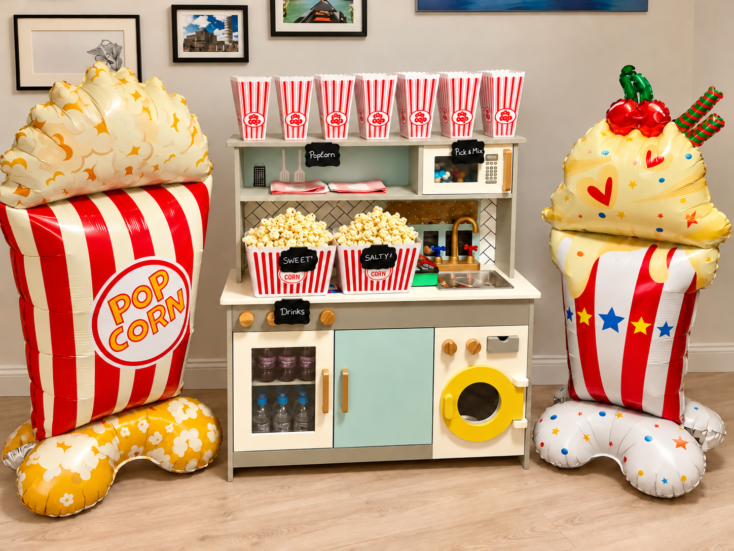 Children's popcorn party station with tubs overflowing with fresh popcorn